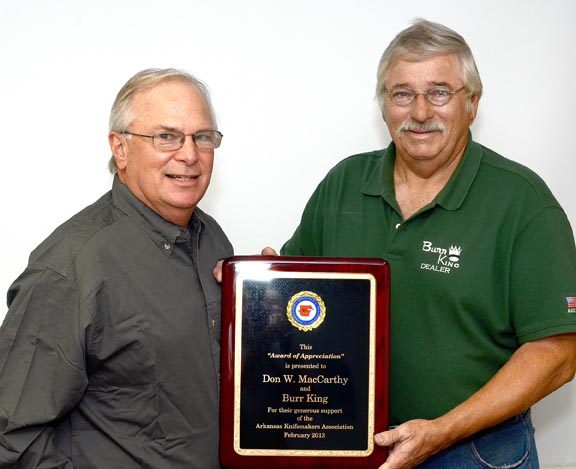 Don MacCarthy, left, receives an `Award of Appreciation from Tom Mcginnis on behalf of the Arkansas Knifemakers Association.