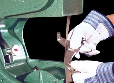 Slack belt grind, contact wheel grind or use the work table.